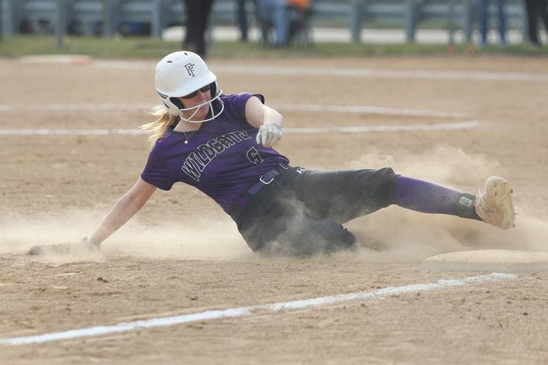 Wilmington’s Taylor Stefancic steals third against Joliet Central on Tuesday, March 12 in Joliet.