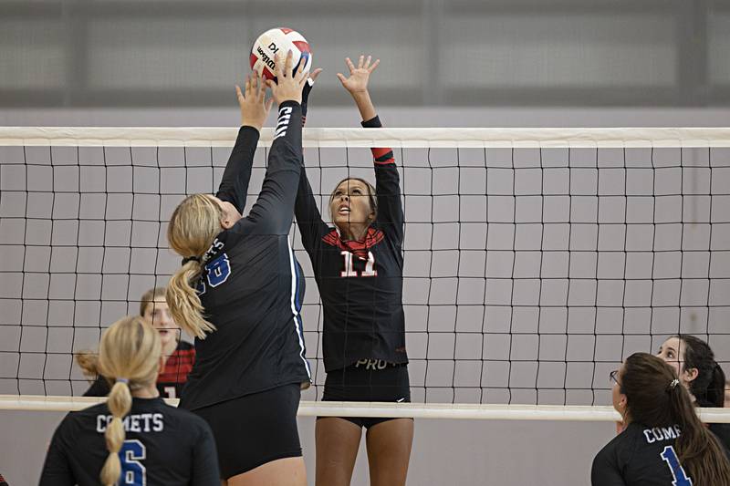 Forreston’s Letrese Buisker works the net against Newman’s Kennedy Rowzee Saturday, Sept. 30, 2023 during the Sterling Volleyball Invitational held at Challand Middle School.