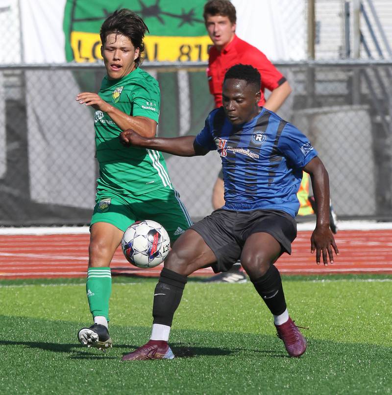 A DeKalb County United player (left) pressures a Rockford FC player during their game Saturday, July 29, 2023, at the Soccer & Track and Field Complex at Northern Illinois University in DeKalb.