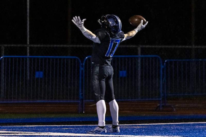 Lincoln-Way East's Jack Murphy celebrates after scoring a touchdown during a varsity football round one playoff game against Stevenson at Lincoln-Way East on Oct. 31, 2025.