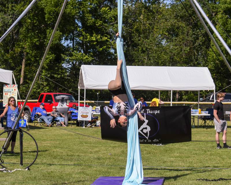 Liliana Rugerio, 13, of Cortland, shows off her skills upside down with Sycamore Performing Arts Academy during Cortland Summerfest held at Cortland Community Park on Saturday, Aug. 10, 2024.