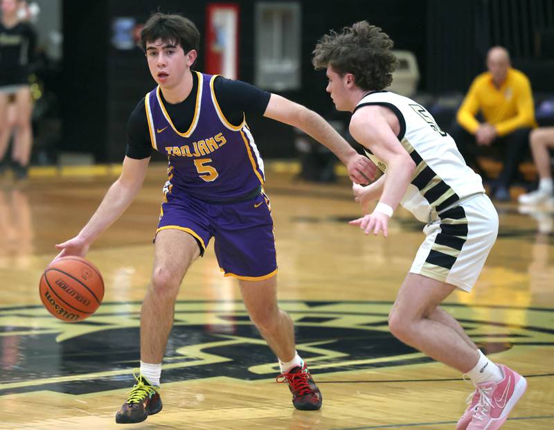 Mendota's Cam Kelly tries to get around Sycamore's Preston Picolotti during their game Wednesday, Dec. 13, 2023, at Sycamore High School.