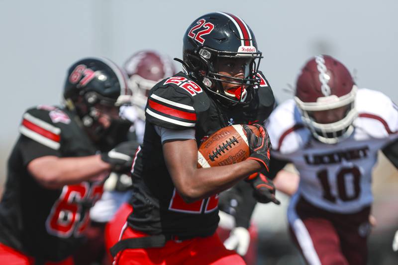Bolingbrook wide receiver Kyan Berry-Johnson runs after making a catch April 3 against Lockport in Bolingbrook.