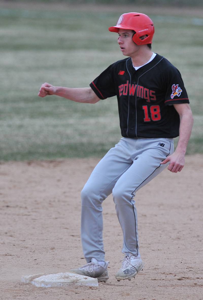 Benet's Jack Kane arrives at second base with an RBI double against Nazareth during a game on Apr. 12, 2022 at Nazareth Academy in LaGrange Park.
