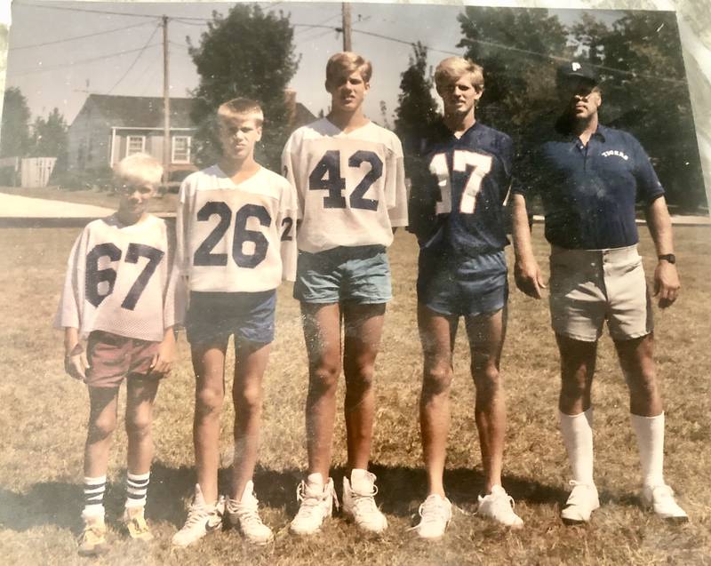 PHS coach Lee Wahlgren (right) lines with his four boys - Kristian (from left), Kipp, Kai and Erick. The brothers won four state championships and eight state medals and received 32 varsity letters between them for PHS.