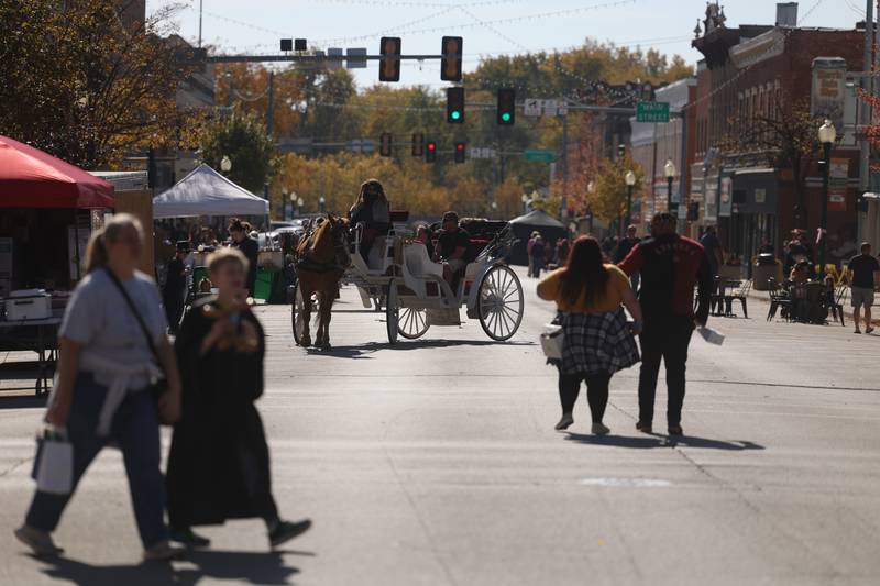 Liberty Street in downtown Morris is transformed into the magical world of Harry Potter with themed shops and tents at the Magic in Morris event on Saturday.