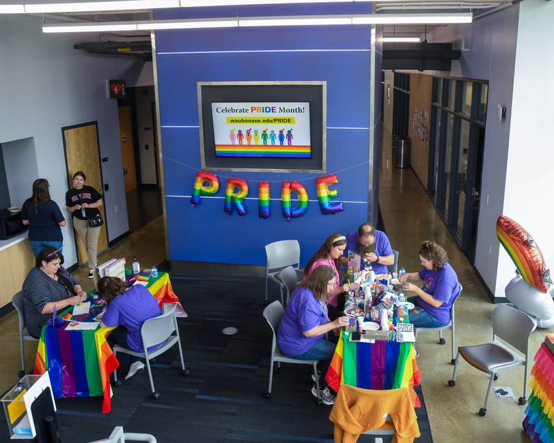 Participants create artwork during the pride party held at Waubonsee Community College Plano’s campus on Thursday June 29, 2023.