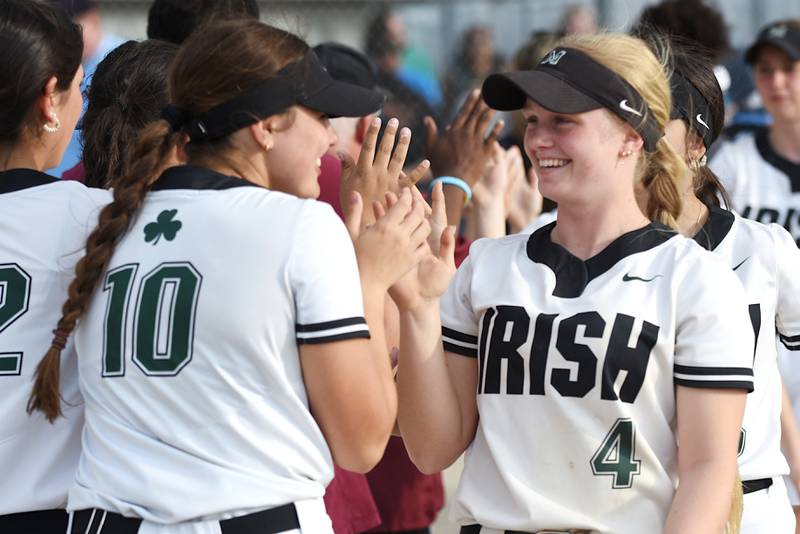 Bishop McNamara's Teagan McCue, right, and Rhaya DePaolo celebrate the Fightin' Irish's 13-6 home victory against Kankakee Tuesday, May 13, 2025.