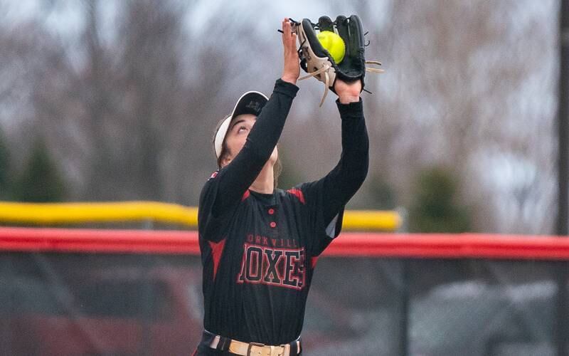 Yorkville's Ellie Alvarez (13) catches a popup for an out against Neuqua Valley during a softball game at Yorkville High School on Wednesday, April 6, 2022.