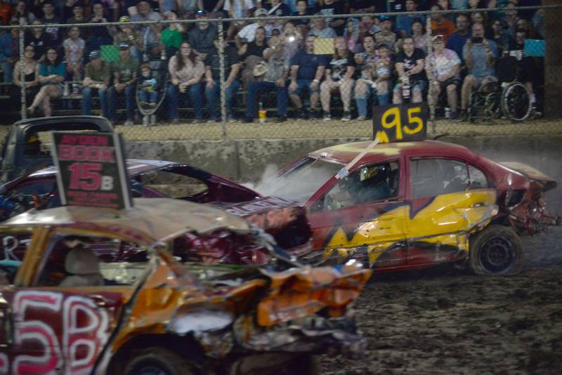 Cars collide in the Compact Heat at the Ogle County Fair's demolition derby on Saturday, Aug. 2, 2025.