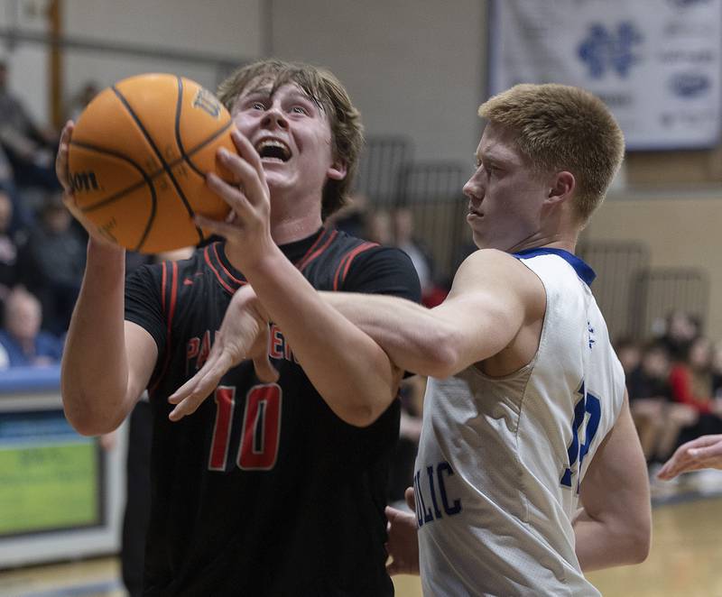 Newman’s George Jungerman fouls Erie-Prophetstown’s Evan Steimle Wednesday, Jan. 29, 2025, at Newman High School.