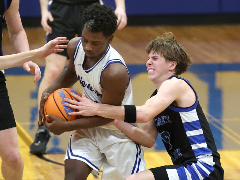 Newark's Reggie Chapman (left) and Hinckley-Big Rock's Harrison Nier fight for a loose ball Friday, Feb. 6, 2026, during their Little 10 Conference third place game at Somonauk High School.