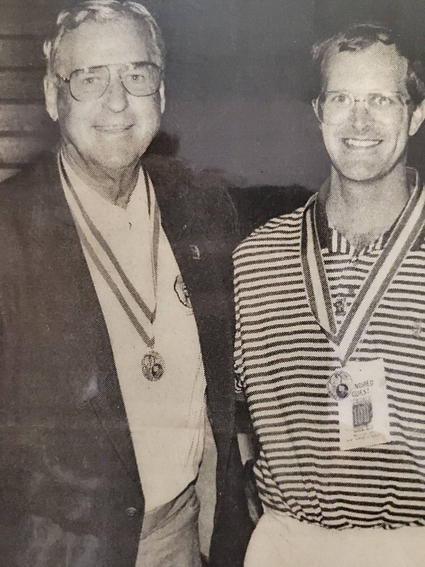 Dwight "Dike" Eddleman of Centralia and Lonnie Hewitt of Buda Western High School, are the only two athletes in the state of Illinois to win the state high jump championship three times. They met for this picture in 1994 during the IHSA's 100th anniversary of its state track finals.