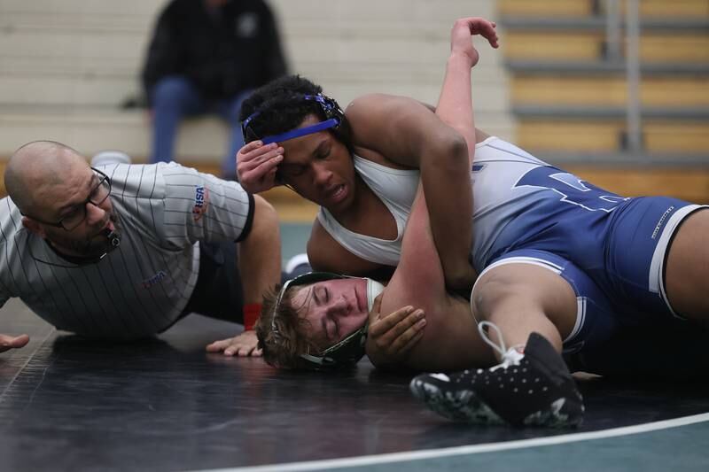 Plainfield South’s Julius Pierscionek works over Plainfield Central’s Michael Laudadio in the 190-pound match on Wednesday, Jan. 8, 2025.