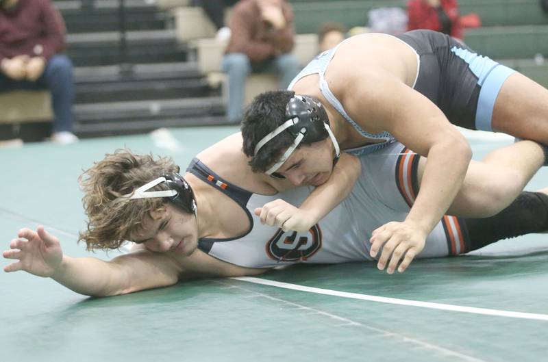 Marquette's Alex Schaefer wrestles Sandwich's Devon Blanchard in the 215 pound weight class during the Class 1A Regional meet on Saturday, Feb. 8, 2025 at St. Bede Academy.