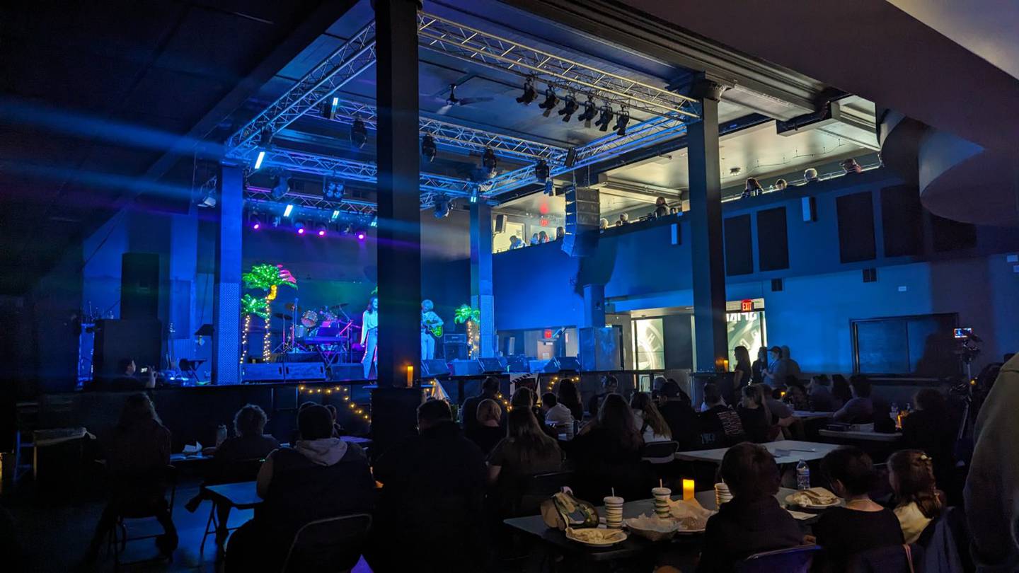 Attendees listen to a free concert on Sunday, April 30, 2023, at The Forge in Joliet. The concert was presented by The 815, a nonprofit that gives youth the opportunity to showcase their musical talents on a professional stage.