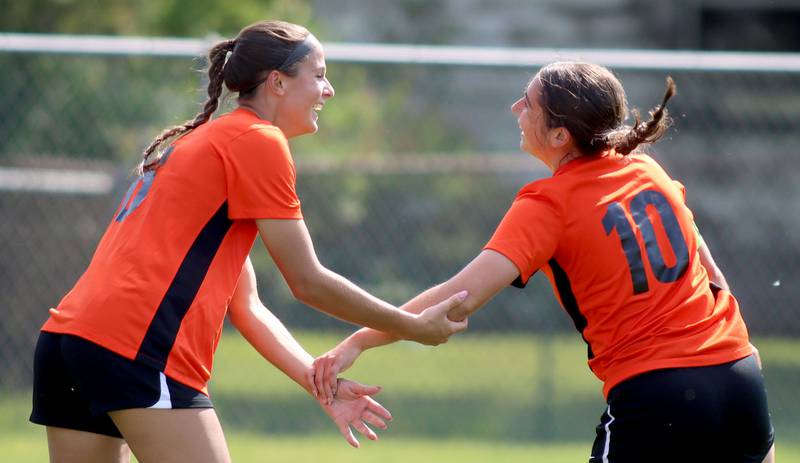 Crystal Lake Central’s Ella Bechler, left, greets Addison Schaffer, right, after a Schaffer goal against Hononegah in IHSA Class 2A Sectional Semifinal girls soccer on Monday, May 25, 2026 at Crystal Lake Central High School in Crystal Lake.