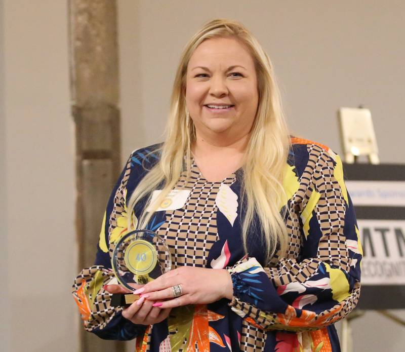 Jenica Cole, Executive Director, Princeton Area Chamber of Commerce, poses for a photo with her award during the Illinois Valley Chamber of Commerce 40 Under Forty Awards Gala on Thursday, Feb. 9, 2023 at Westclox in Peru.