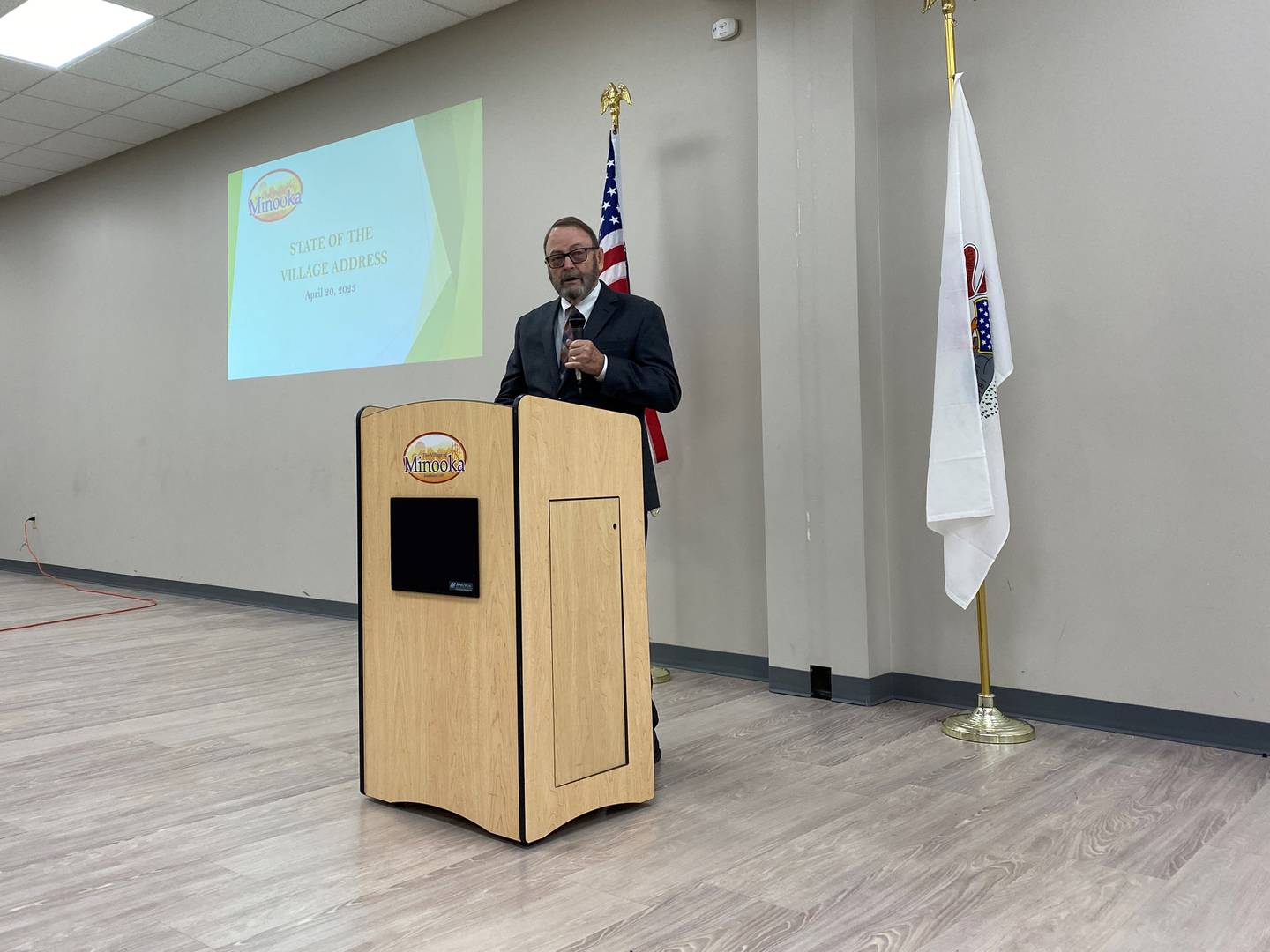 Minooka Village President Ric Offerman addresses the crowd during the State of the Village on Thursday.