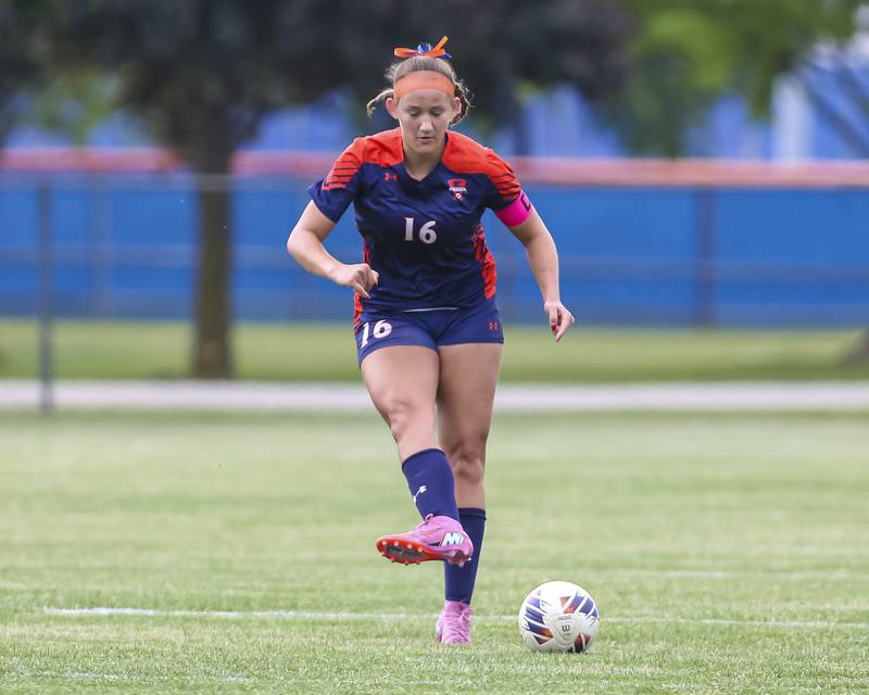 Oswego's Peyton Johnson (16) passes the ball off to a teammate during Class 3A regional final soccer match between Neuqua Valley at Oswego on Saturday, May 23, 2026 in Oswego.