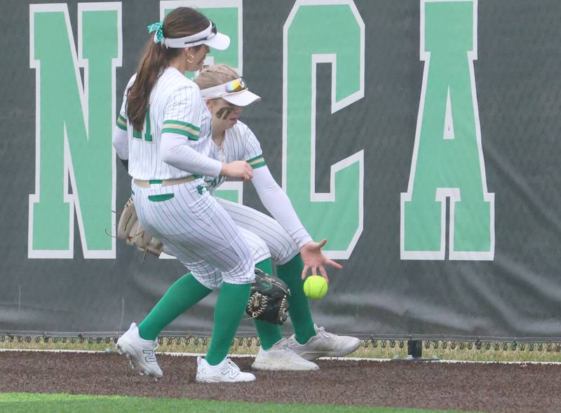 Seneca's Graysen Provance and teammate Aurora Weber chase after the ball on the warning track against Geneseo on Thursday, March 12, 2026 at Seneca High School.
