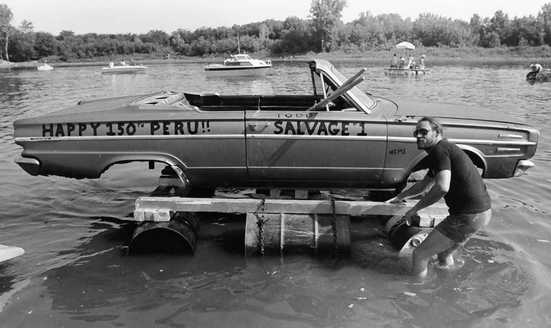 The Anything That Floats races were held from 1978-1986 each year in Peru. Contestants received a free case of Old Style beer upon entering. The rules were simple. To enter, participants needed to build a raft less than 50 feet in length and each person had to have a life jacket on board whether you wore it or not. A rope had to be attached to the raft for towing. Rafts were made from styrofoam, inter tubes or barrels. A minimum of two paddles were required on the float. Rafts were launched at the Starved Rock Boat Ramp and finished at the Peru boat launch area. Over time, the event grew and got to big and out of control that organizers had to scrap it. This photo was found in the La Salle NewsTribune archives.