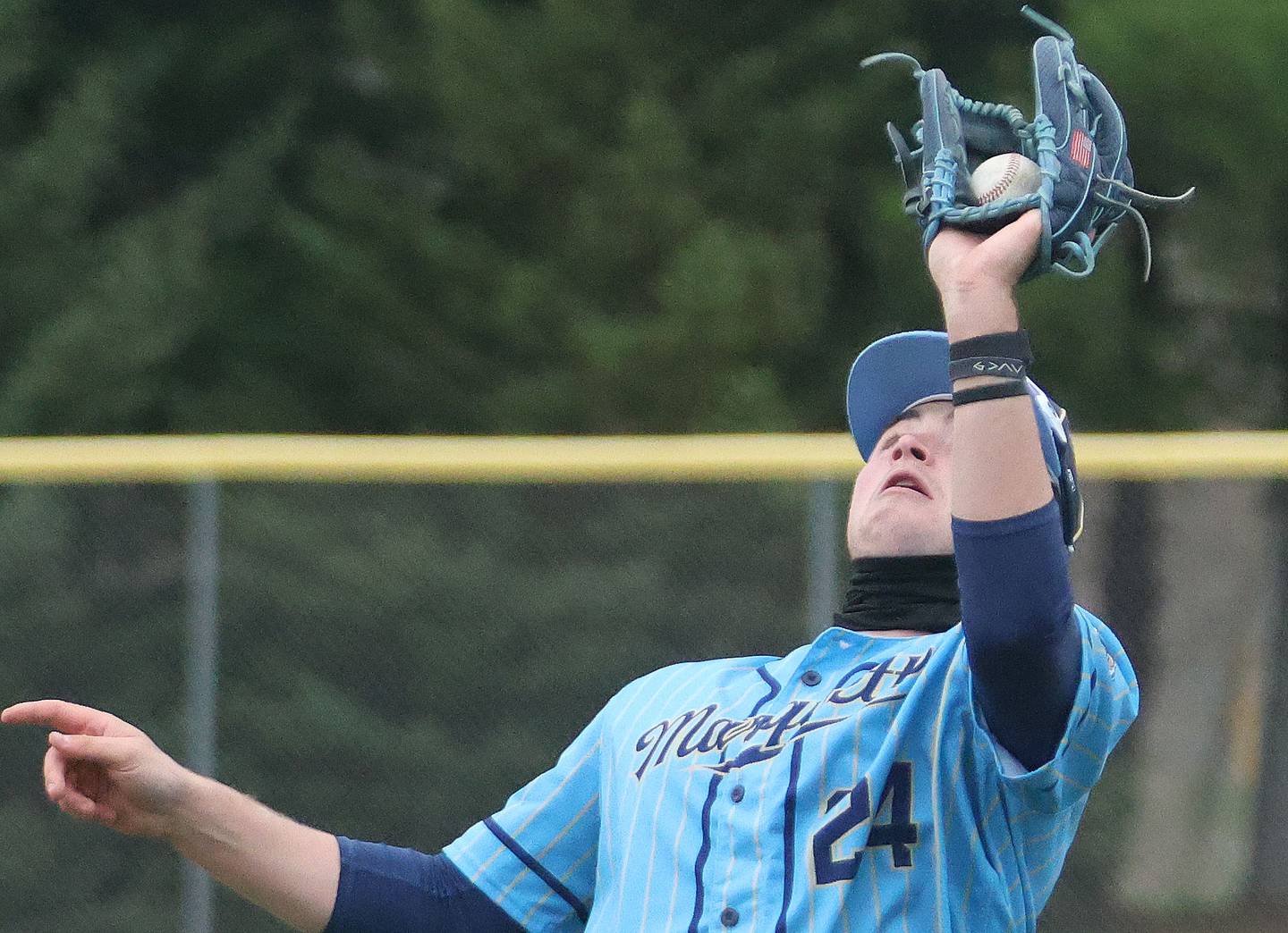 Marquette's Anthony Couch makes a running catch against Eureka on Wednesday, April 1, 2026 at Masinelli Field in Ottawa.