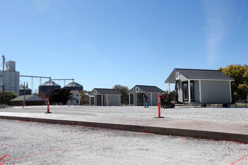 Crews move huts into the retail site plaza on Wednesday, Oct. 16, 2024 downtown Utica.