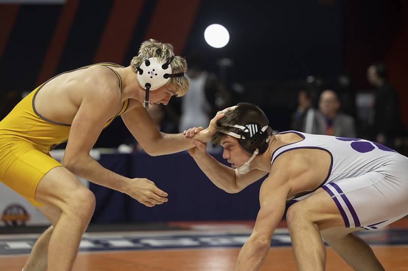 Wilmington’s Logan VanDuyne (right) and Lena-Winslow’s Eli Larson compete in the 1A 190 pound class  Saturday, Feb. 21, 2026, at the IHSA wrestling finals in Champaign.