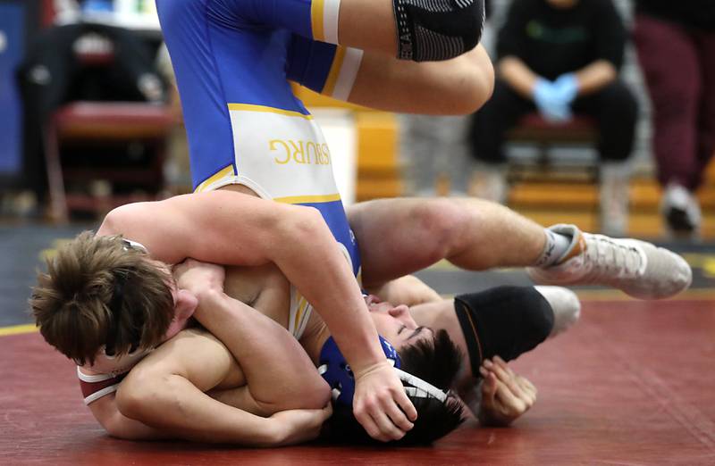 Marengo’s Logan Boley battles with Johnsburg’s Kainoa Ancog during a 157-pound match in the Tom DuBois Invite wrestling meet on Saturday, Dec. 13, 2025, at Richmond-Burton High School in Richmond.