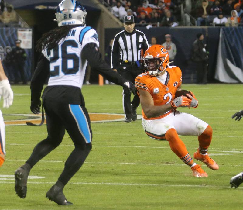 Chicago Bears wide receiver DJ Moore runs the ball away from Carolina Panthers corner back Donte Jackson on Thursday, Nov. 9, 2023 at Soldier Field.