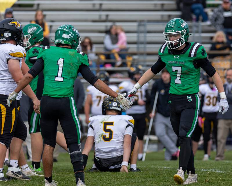 Ethan Othon (1) of Seneca celebrates with teammate Wyatt Biffany (7) on Saturday, November 1, 2025 at Seneca High School in Seneca.