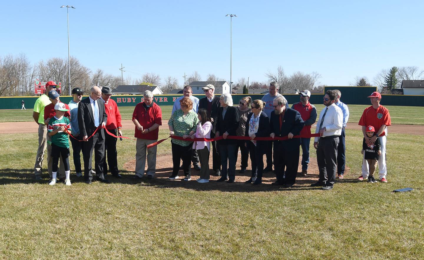 The high school celebrated the completion with a ribbon cutting and naming ceremony on Monday at the baseball/softball complex with the Sarver family, public officials, former and current athletes.