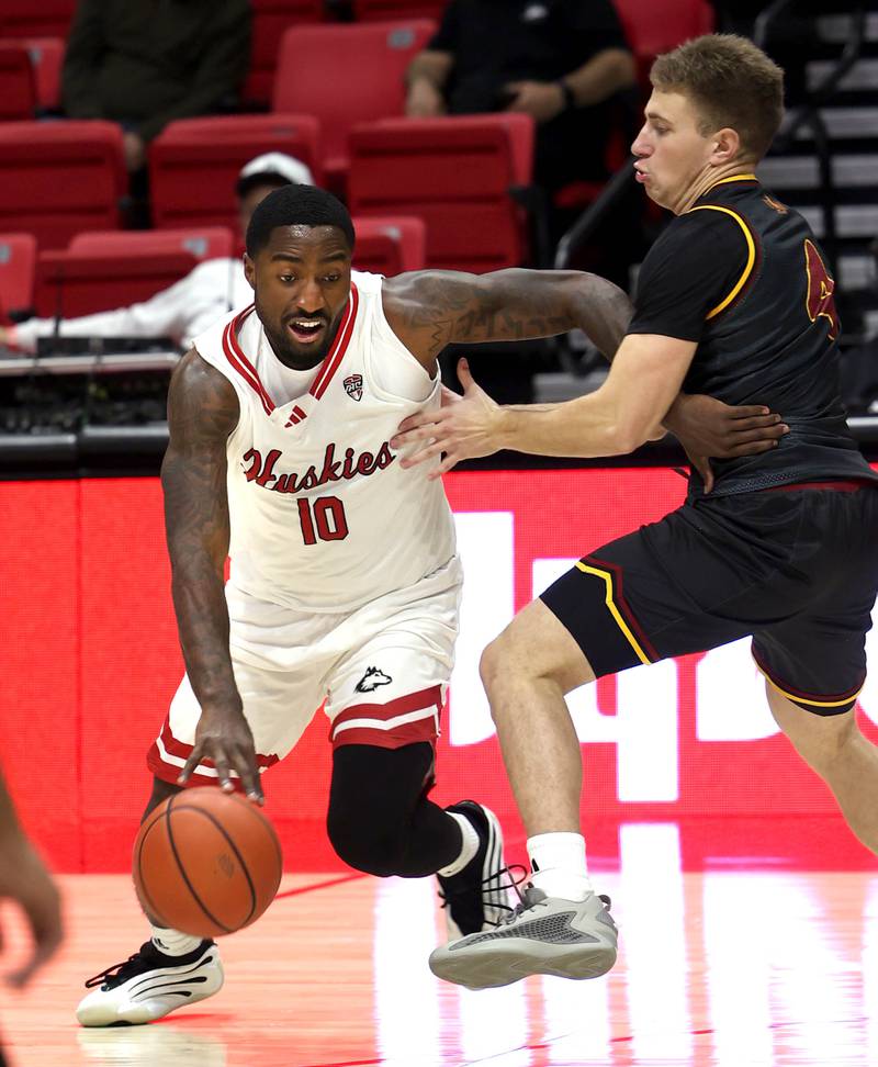 Northern Illinois guard Jao Ituka drives against Louisiana-Monroe's guard Lavell Brodnex Monday, Nov. 3, 2025, during their game at the Convocation Center at NIU in DeKalb.