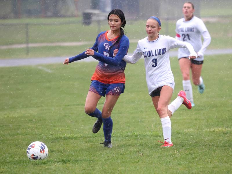 Genoa-Kingston's Jaida Modesto (right) and Rockford Christian's Paige Giardina chase after a loose ball Tuesday, May 20, 2025, during their Class 2A regional final game at Rockford Christian High School.