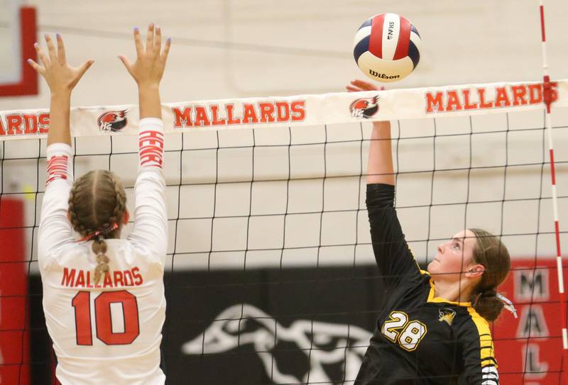 Putnam County's Kennedy Holocker spikes the ball past Henry-Senachwine's Rachel Eckert on Thursday, Aug. 28, 2025 at Henry-Senachwine High School.