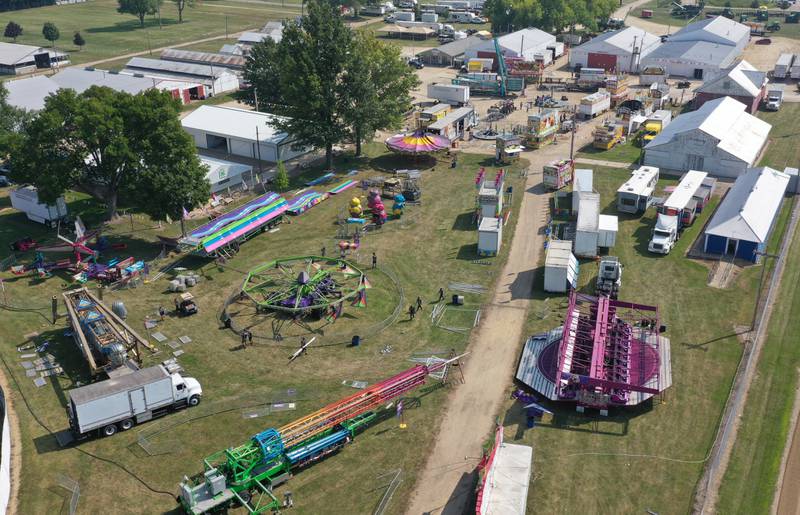 An aerial view of carnival workers setting up the 168th annual Bureau County Fair on Tuesday, Aug. 22, 2023 in Princeton. The fair runs Wednesday through Sunday.