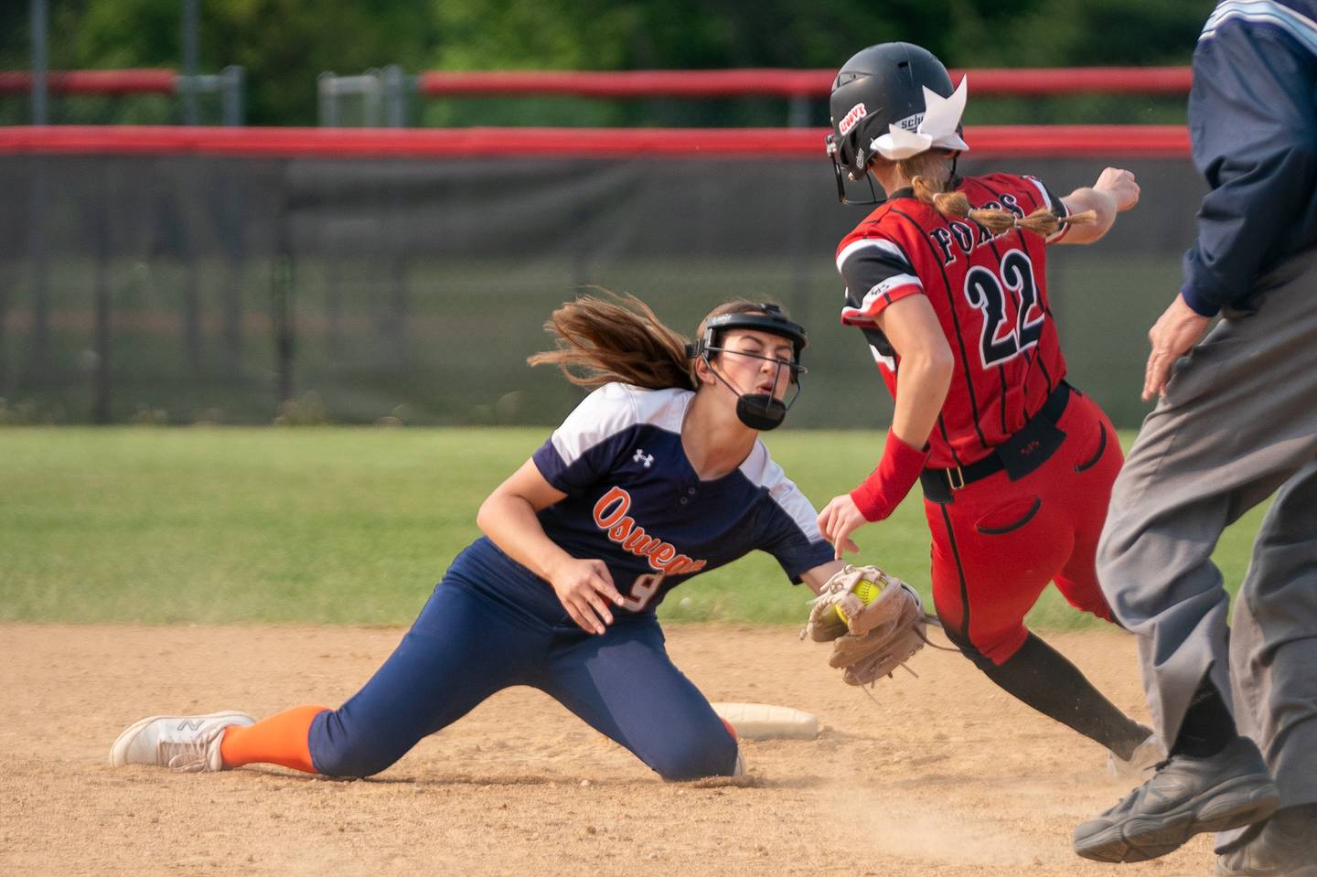 Oswego’s Madelyn Hernandez (9) tags Yorkville's Allyson Stancel (22) for an out on a steal attempt during a softball game at Yorkville High School on Wednesday, May 17, 2023.