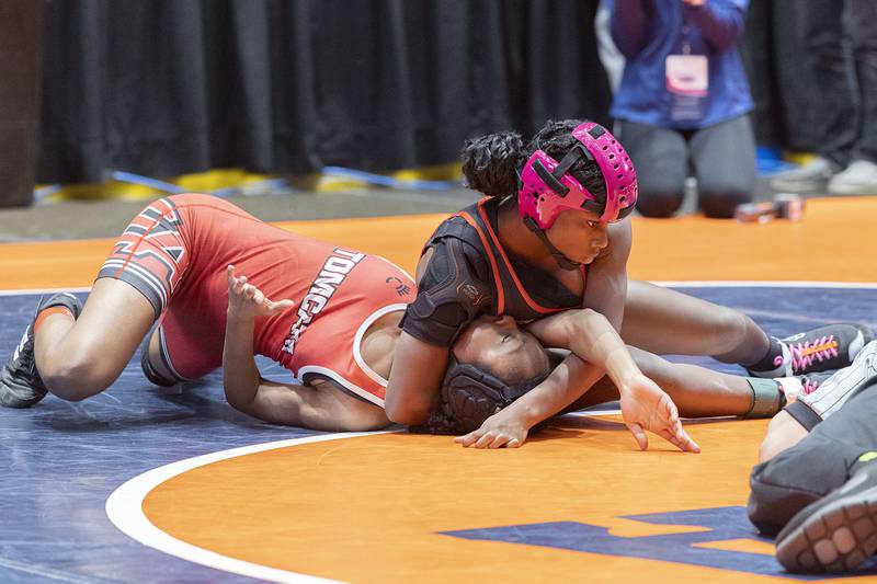 Jania Slaughter of Huntley pins Kameyah Young of Aurora in the third place 100 pounds match at the IHSA girls state wrestling championship Saturday, Feb. 25, 2023.