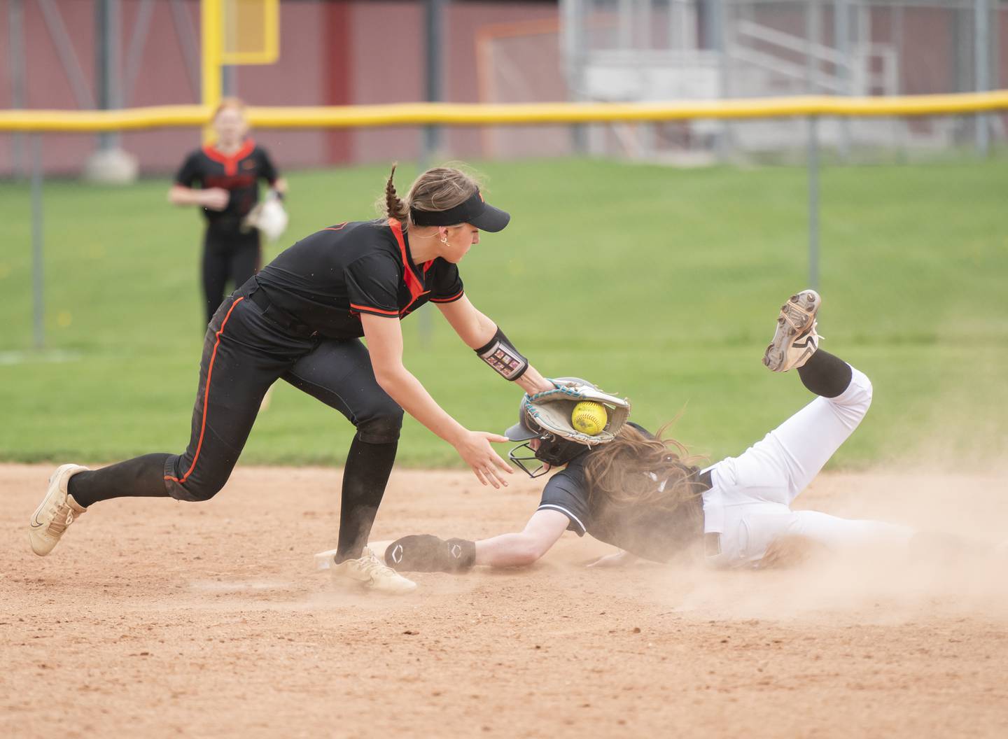 McHenry's Elyse Fullington misses the tag as Huntley's Lana Hobday slides into second base safe during their game on Wednesday, April 30, 2025 at Huntley High School. Ryan Rayburn for Shaw Local