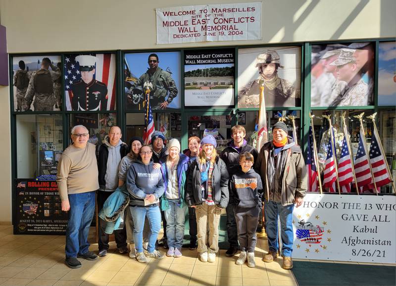 Marseilles Mayor Jim Hollenbeck (left) joins the group from the RiverGlen Christian Church in Waukesha, Wisc. for a tour of the Middle East Conflicts Museum on Wednesday in Marseilles.