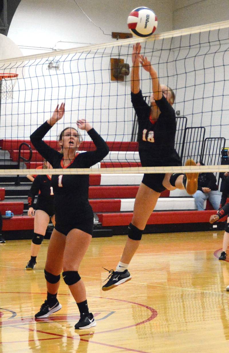 LaMoille's Grace Kellly (1) and Ella Ryan make a play at the net in Tuesday's match with Henry-Senachwine.