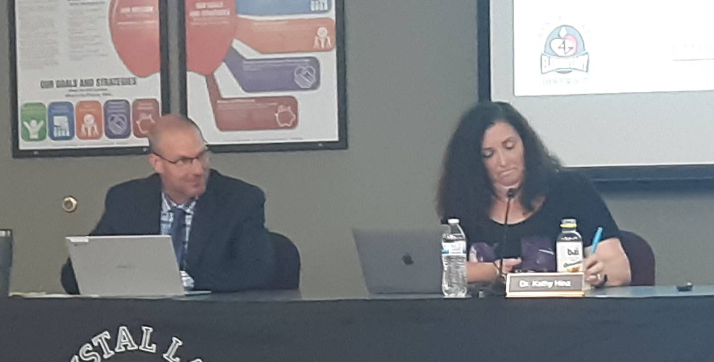 Crystal Lake Elementary School District 47 school Board President Rob Fetzner and Superintendent Kathy Hinz listen to public comment at a board meeting Monday, July 19, 2021.