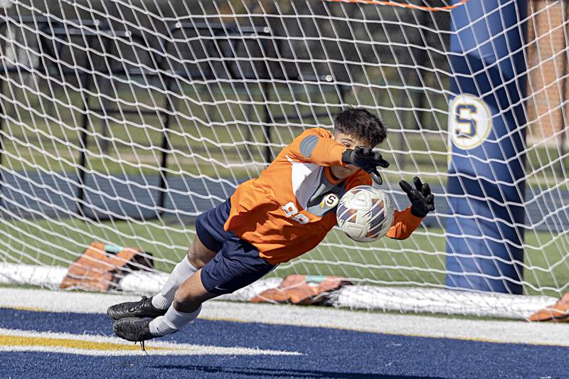 Sterling goalie Marco Chino dives to save a ball against Dunlap Saturday, Oct. 21, 2023 in the regional finals game in Sterling.