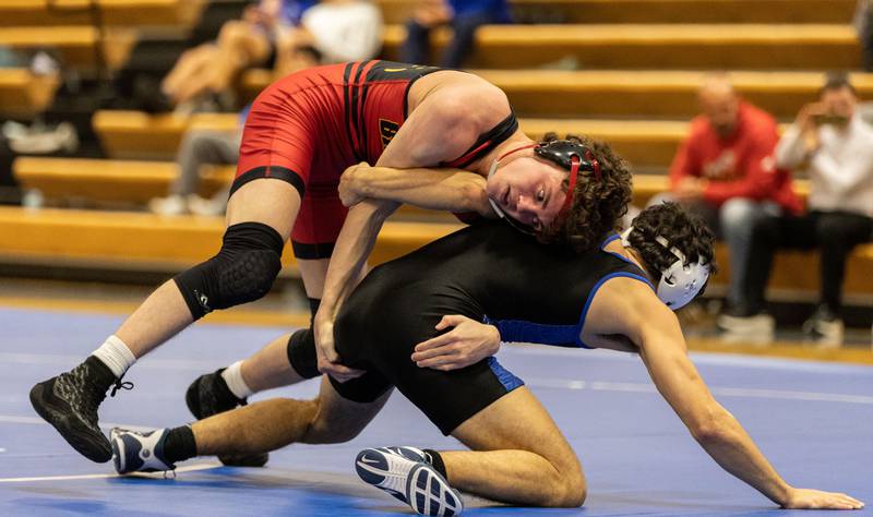 Batavia’s Jack Duraski, left, attempts to hold a position on top of Geneva’s Ben Deasy at Geneva High School on Thursday, Dec. 19, 2024. Duraski won the match.