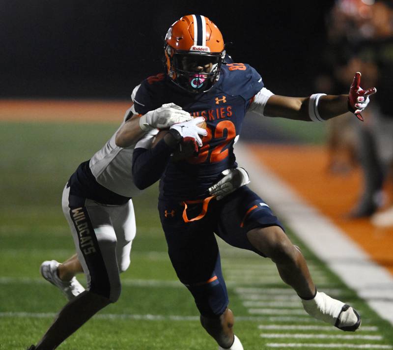Naperville North’s Chico Thomas, front, is taken out of bounds by Neuqua Valley’s Andrew Hoffman during a football game played on Friday, Oct. 11, 2024 in Naperville.