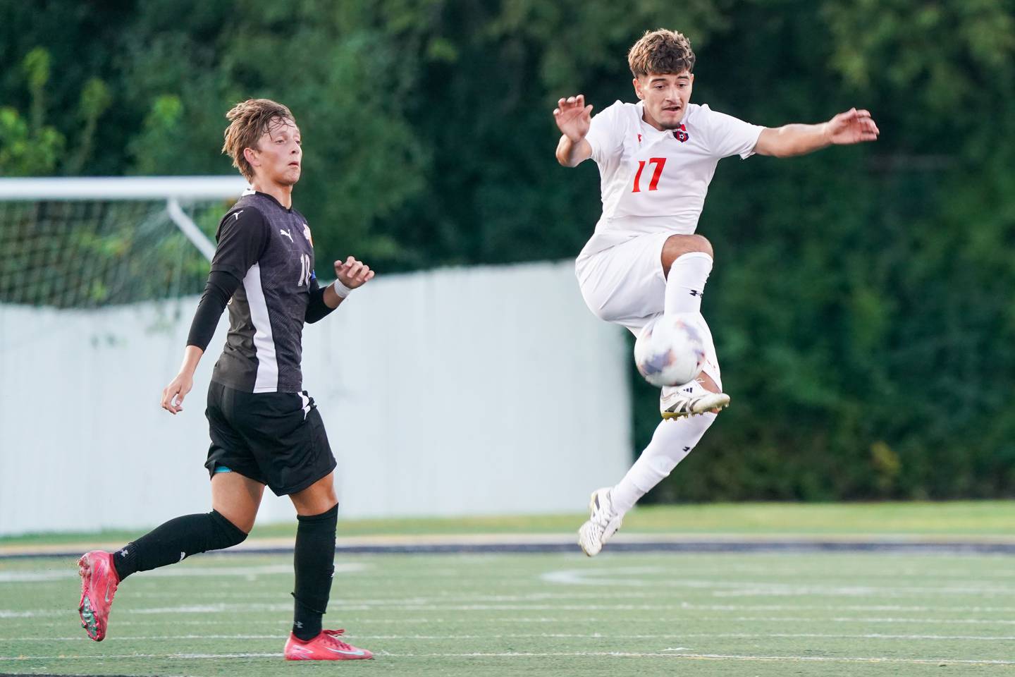 Oswego’s Jonathan Garcia (17) plays the ball against Wheaton Warrenville South's Semin Razman (10) during a soccer match at Wheaton Warrenville South in Wheaton on Thursday, Aug 28, 2025