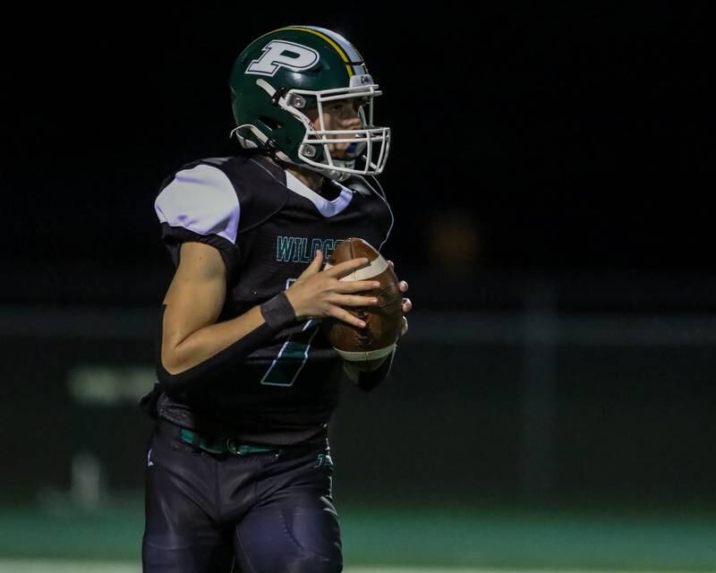 Plainfield Central's Matt Leto (7) looks for an open receiver during football game between Joliet West at Plainfield Central.   Oct 20, 2023.