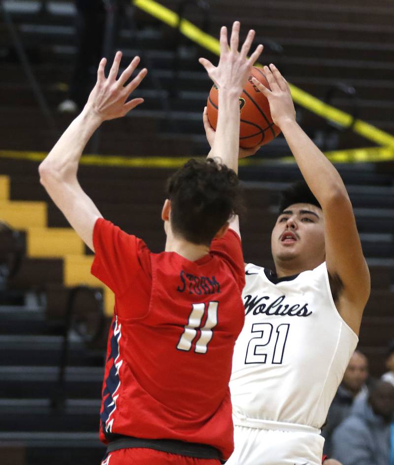 Prairie Ridge's Fernando Rodriguez shoots over South Elgin’s Sean Harvey during a Hinkle Holiday Classic basketball game Tuesday, Dec. 27, 2022, at Jacobs High School in Algonquin.