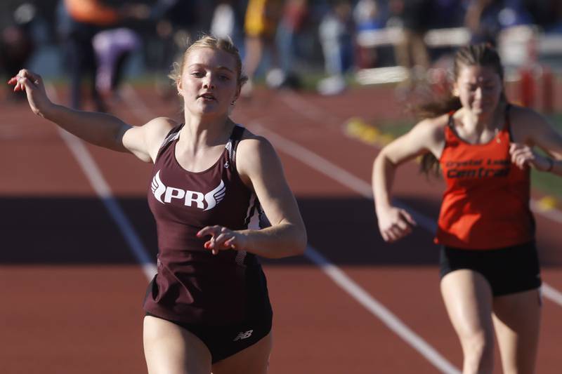 Prairie Ridge’s Katherine Jewell cruises to victory in the 100 meter dash on Thursday, May 8, 2025, during the Fox Valley Conference Girls Track and Field Meet at Huntley High School.